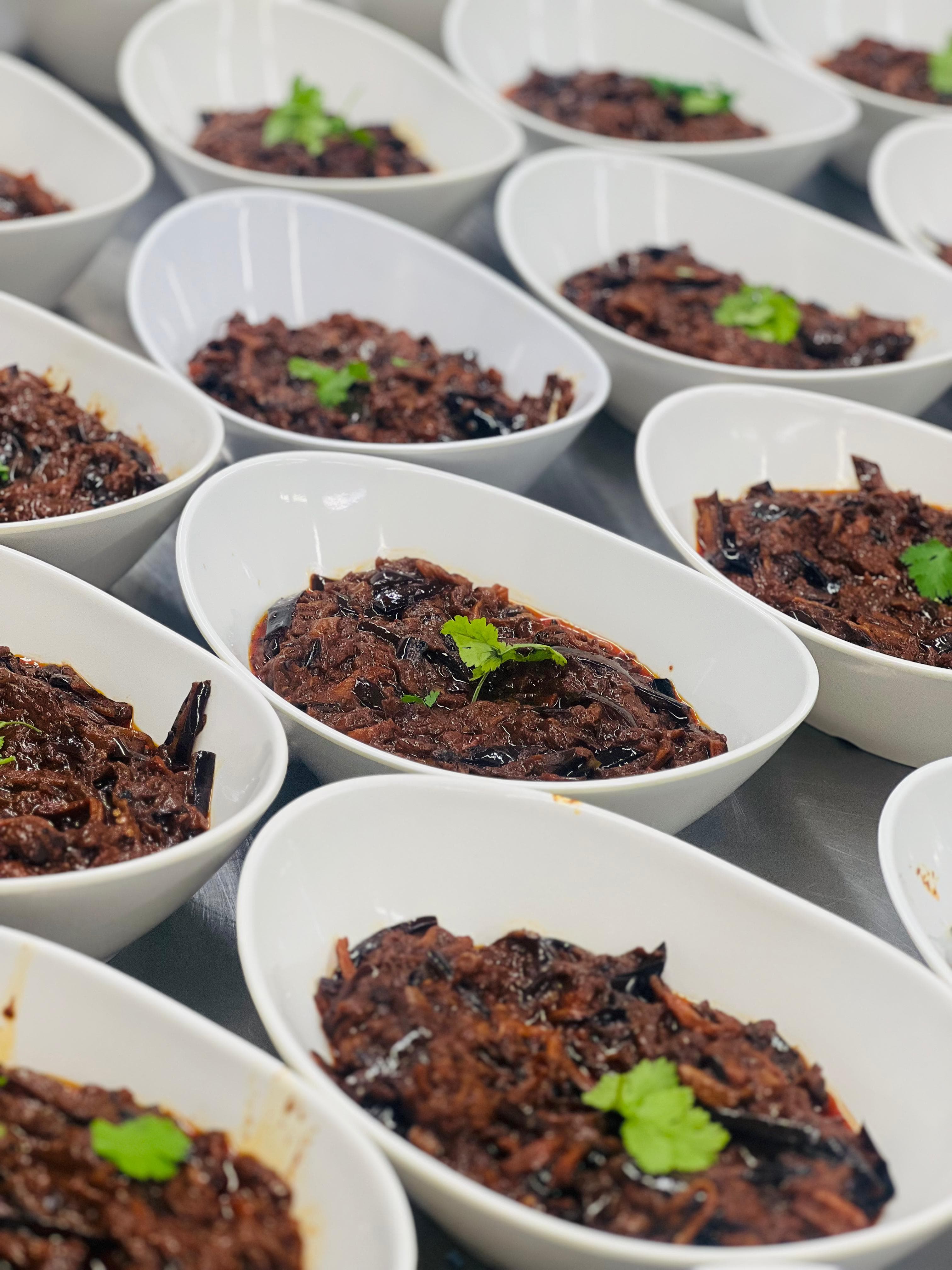 Rich braised dishes served at scale